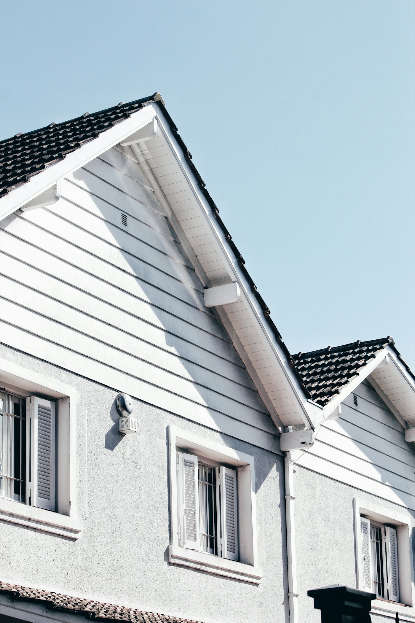 Fresh white siding and clean rooflines