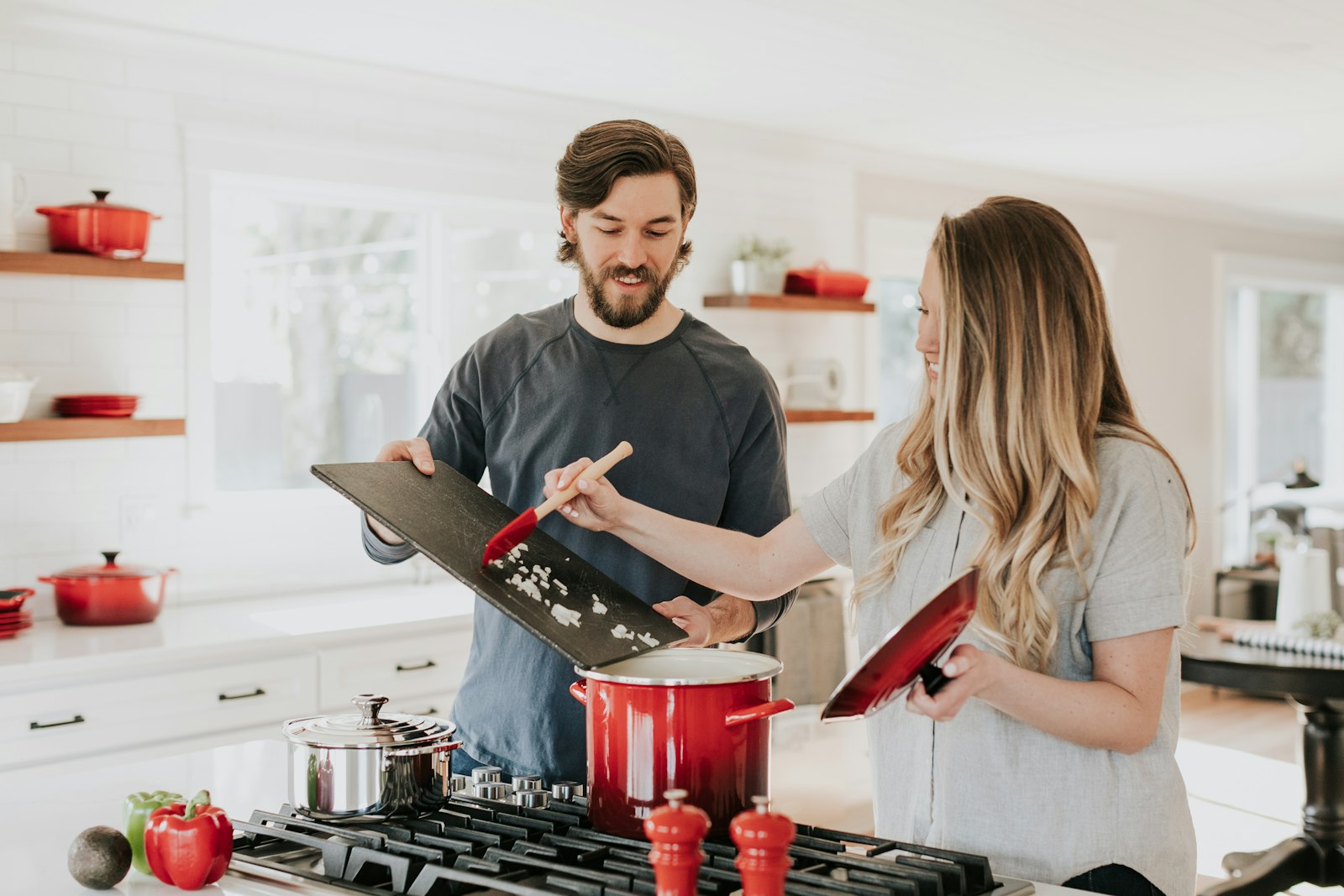 A couple cooking happily in their remodeled kitchen