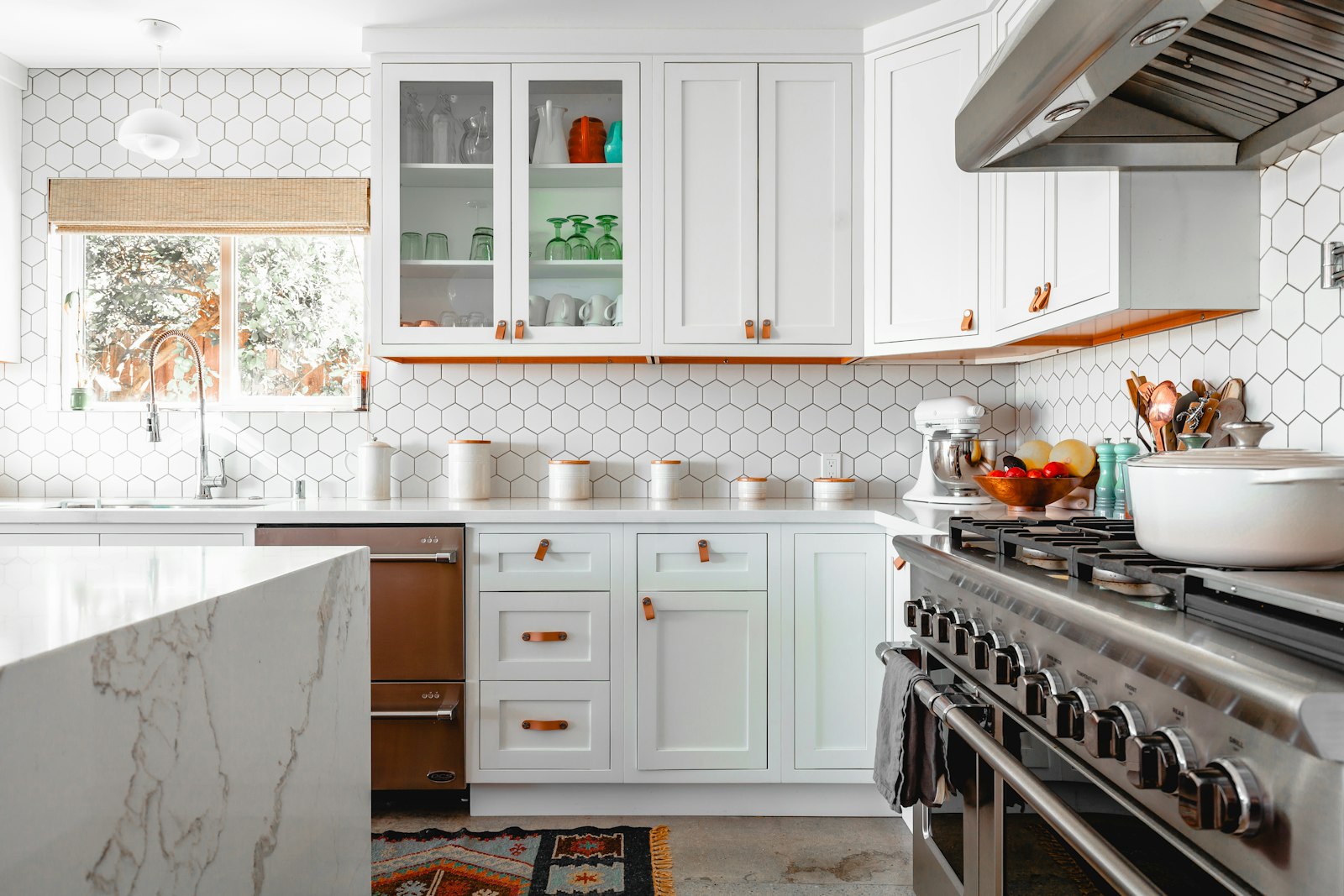 Bright white kitchen with hexagon tile backsplash