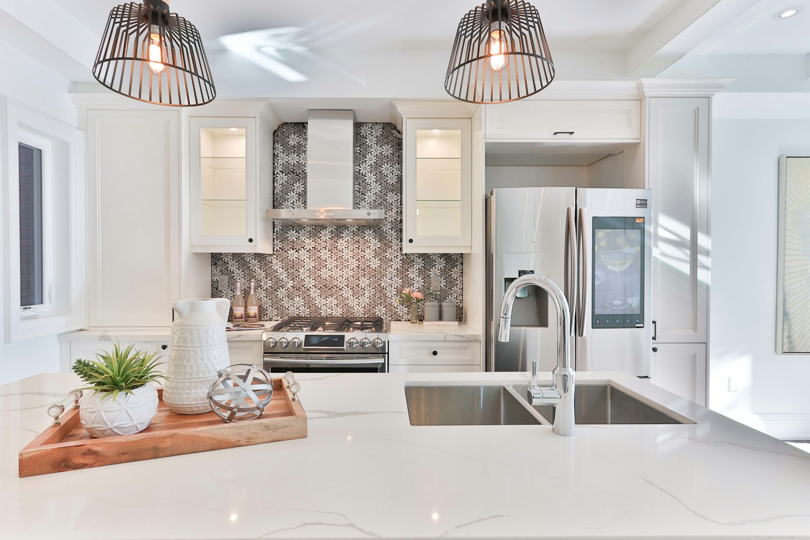 Bright kitchen with patterned backsplash and smart fridge