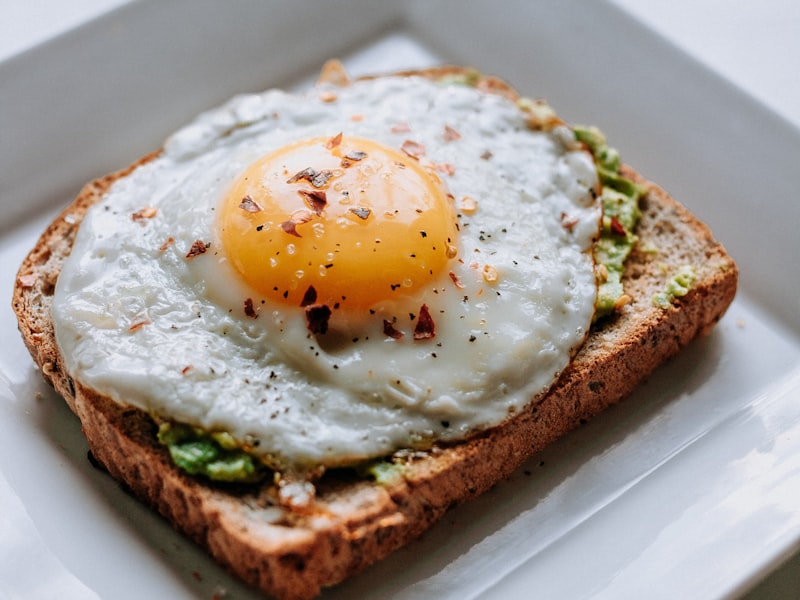 Soft egg over greens with grilled bread